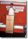 Pastor Julius preaching.