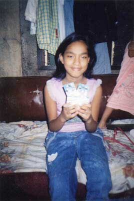 Patient holding medication for hearing. 